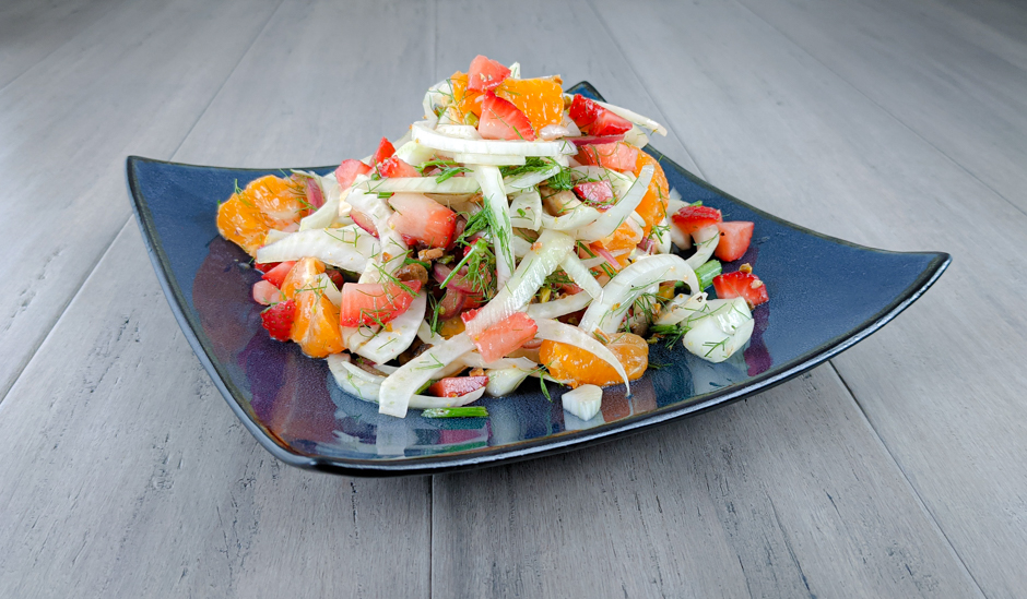Fennel and citrus salad topped with strawberries