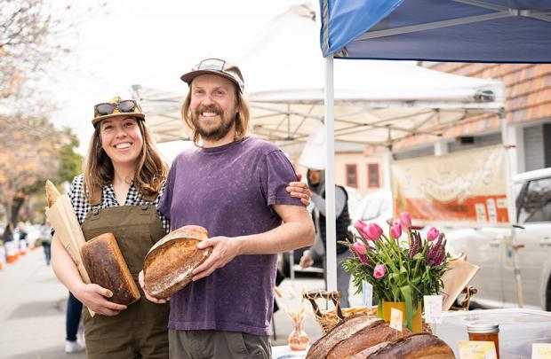 Owners of Night Heron Bread at their stall at the Alameda Farmers' Market