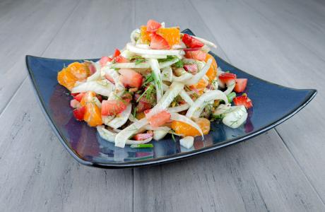 Fennel and citrus salad topped with strawberries