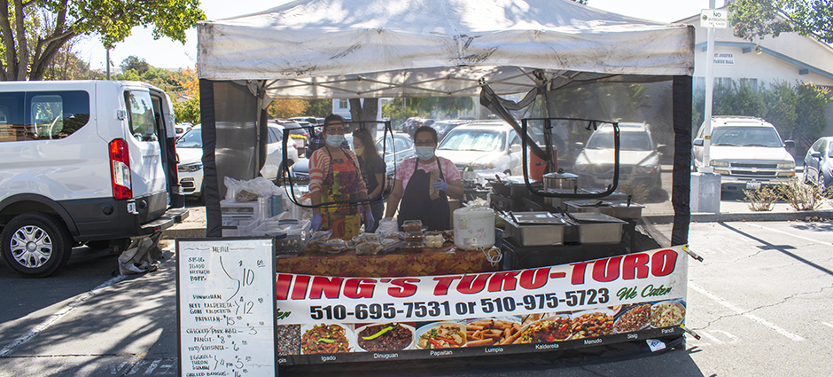 Owners of Ching's Toro Toro in their stall