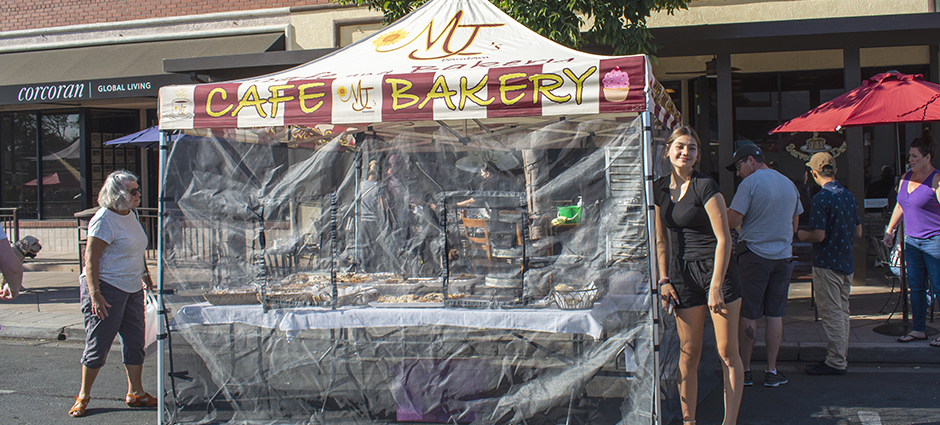 MJ's Bakery worker outside of stall at market 