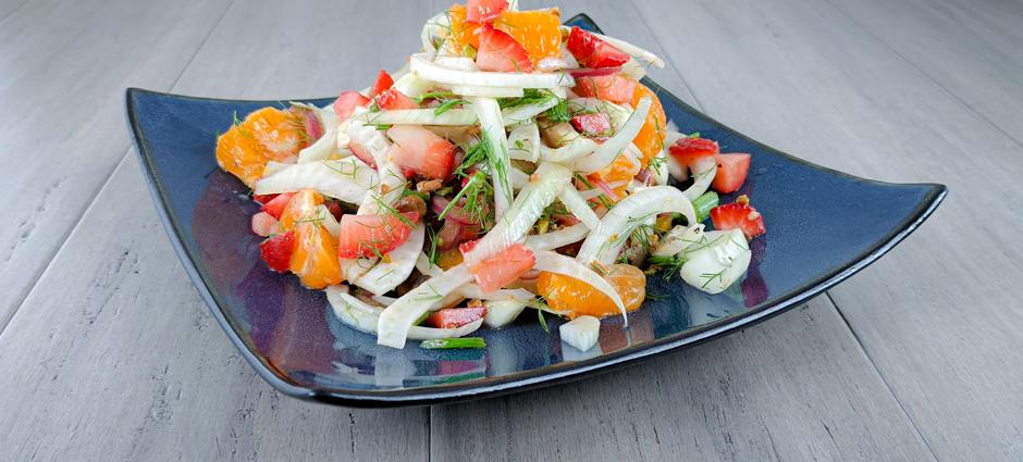 Fennel and citrus salad topped with strawberries