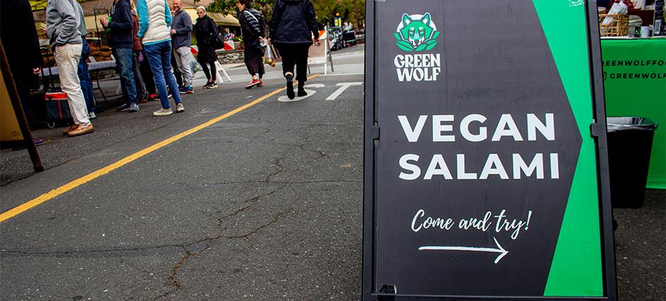 Photo of Green Wolf signage in farmers market
