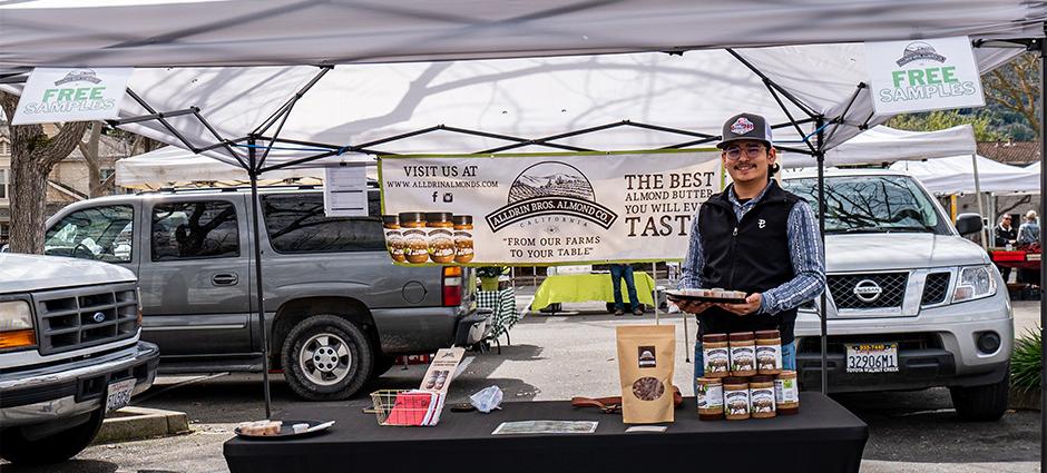 A seller at the Alldrin Bros stall at the Danville Farmers' Market