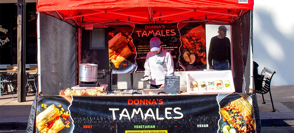 Donna's Tamales worker at her booth in the Brentwood Farmers' Market