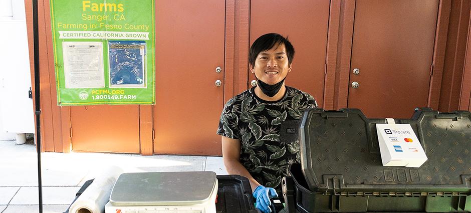 Franklin Thor vendor smiling behind cash register