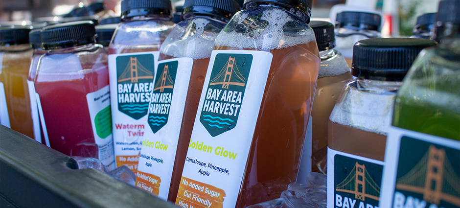 Bay Area Harvest Juice bottles lined up in ice