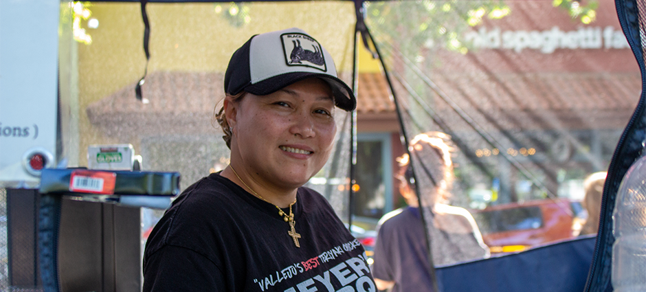 The owner of Meyers BBQ at her stall at the Concord Thursday Farmers' Market